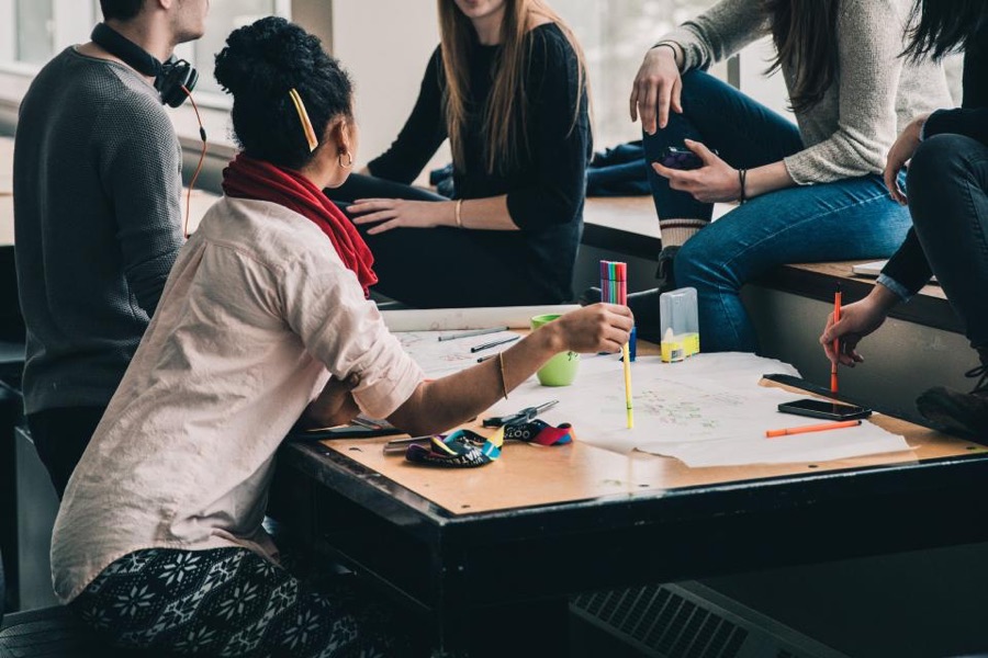A diverse group of young people working together